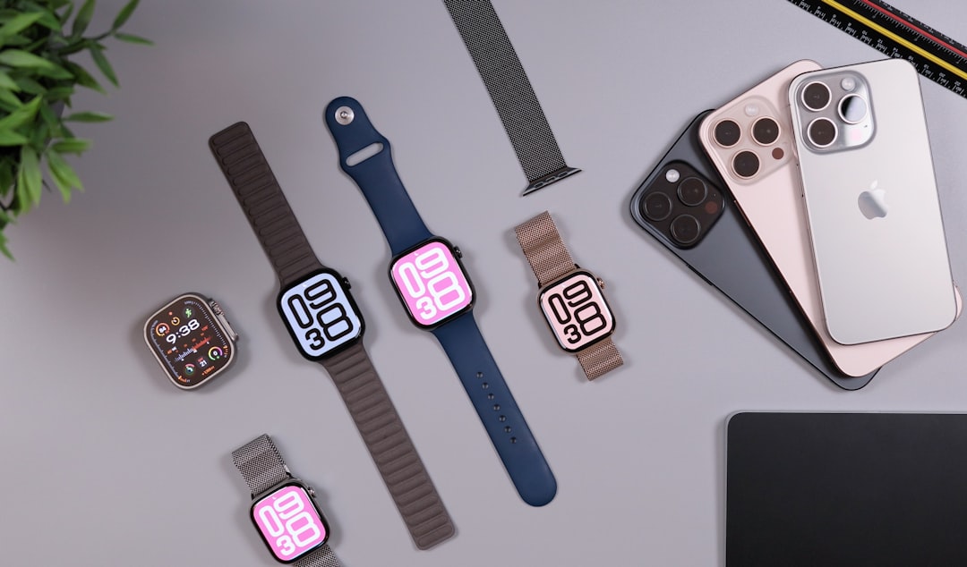 Apple watches and iphones arranged on a desk